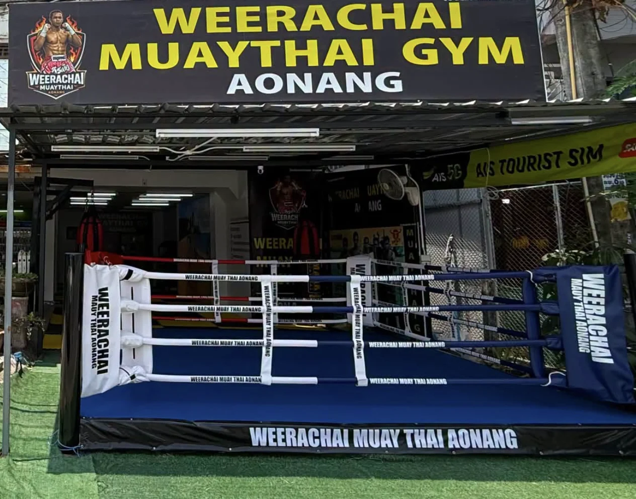 Weerachai Muaythai Gym entrance, sign and boxing ring